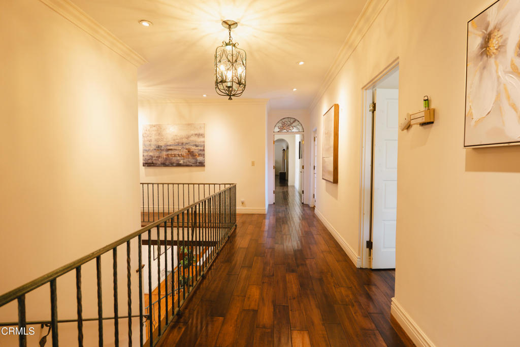 1363 Virginia Road San Marino, CA 91108 - Photo 22 of 29 a view of a hallway with wooden floor and chandelier