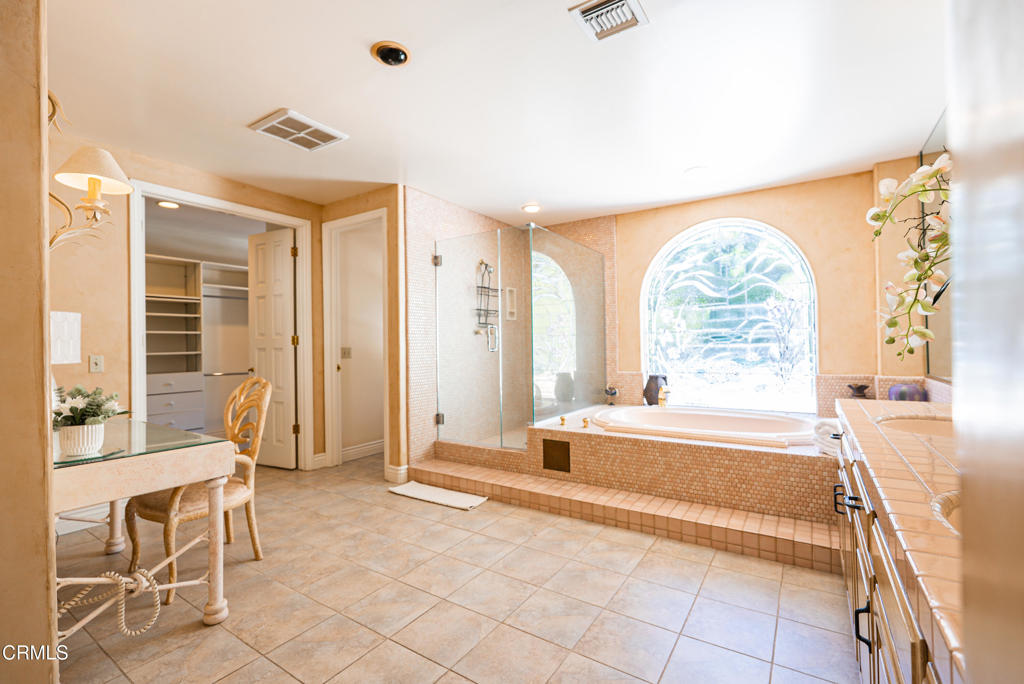1363 Virginia Road San Marino, CA 91108 - Photo 27 of 29 a spacious bathroom with a tub and shower