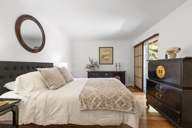 a bedroom with a bed and a dresser