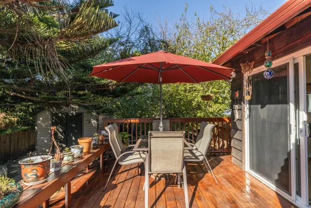 an outdoor space with furniture and umbrella