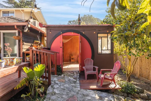 a view of a chairs and table in the patio