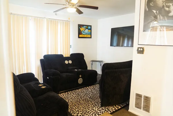 a living room with furniture and a window