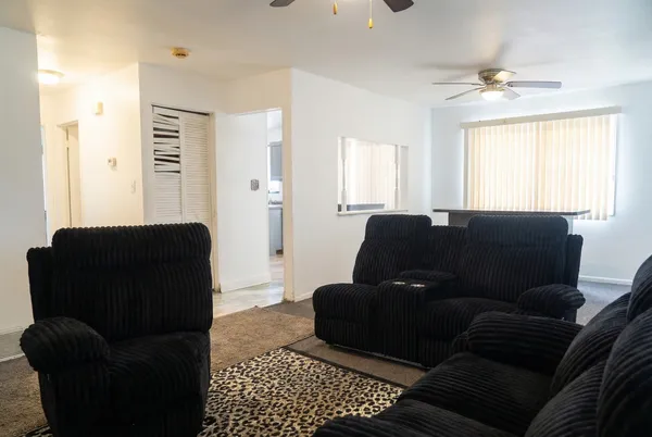 a living room with furniture and a window