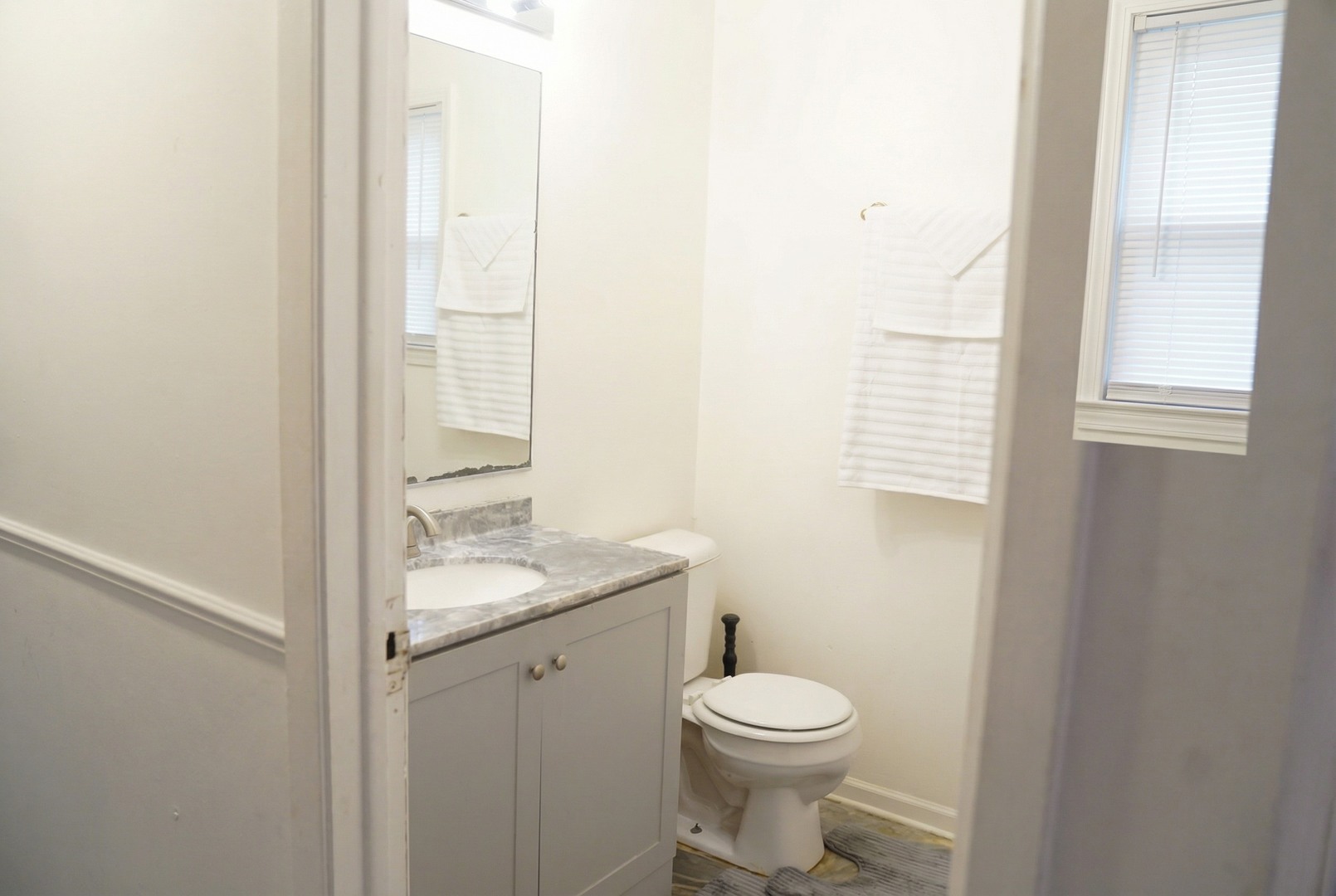 34 Wedgewood Road Matteson, IL 60443 - Photo 8 of 15 a bathroom with a granite countertop toilet a sink and a window