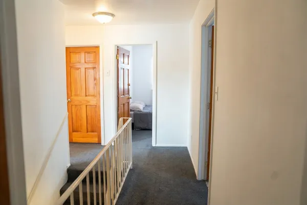 a view of a bathroom from a hallway