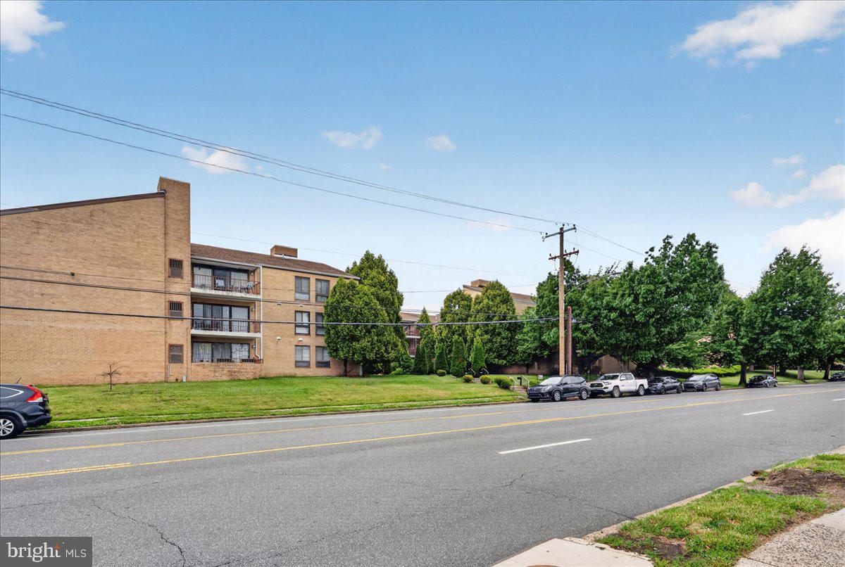 8930 Krewstown Road, Unit 310 Philadelphia, PA 19115 - Photo 31 of 32 a view of a street with a building in the background
