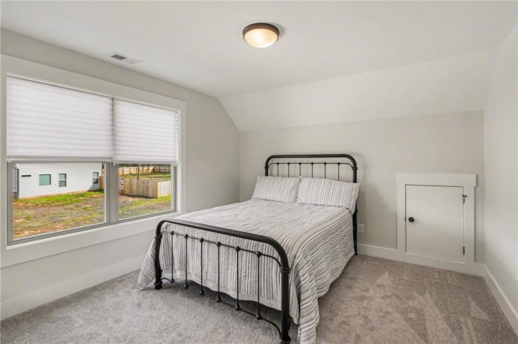 287 Conner Lane Williamson, GA 30292 - Photo 26 of 33 a bedroom with a bed and window