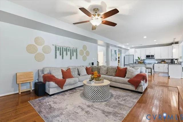 a living room with furniture and a rug