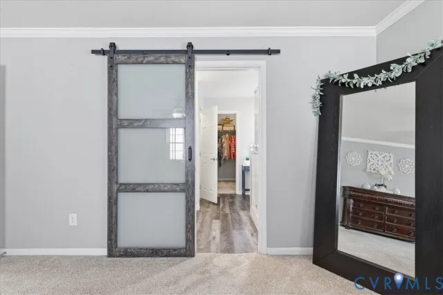 a en suite bathroom with a granite countertop double vanity sink and a mirror