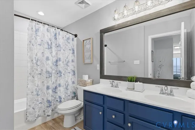 a view of a livingroom with workspace and a couch