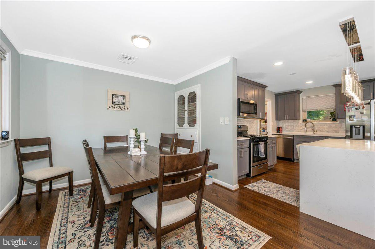 2208 Muskogee Street Adelphi, MD 20783 - Photo 18 of 71 a view of a dining room with furniture and wooden floor
