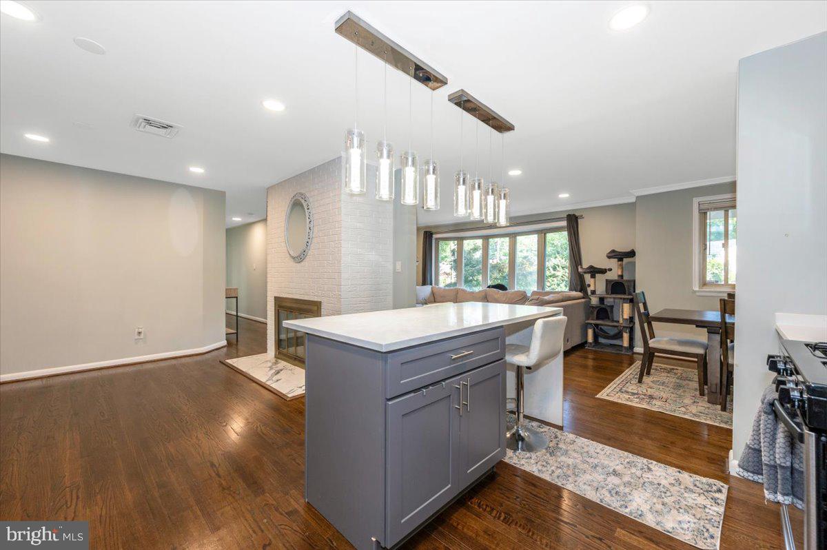2208 Muskogee Street Adelphi, MD 20783 - Photo 24 of 71 a living room with stainless steel appliances granite countertop furniture wooden floor and a view of kitchen
