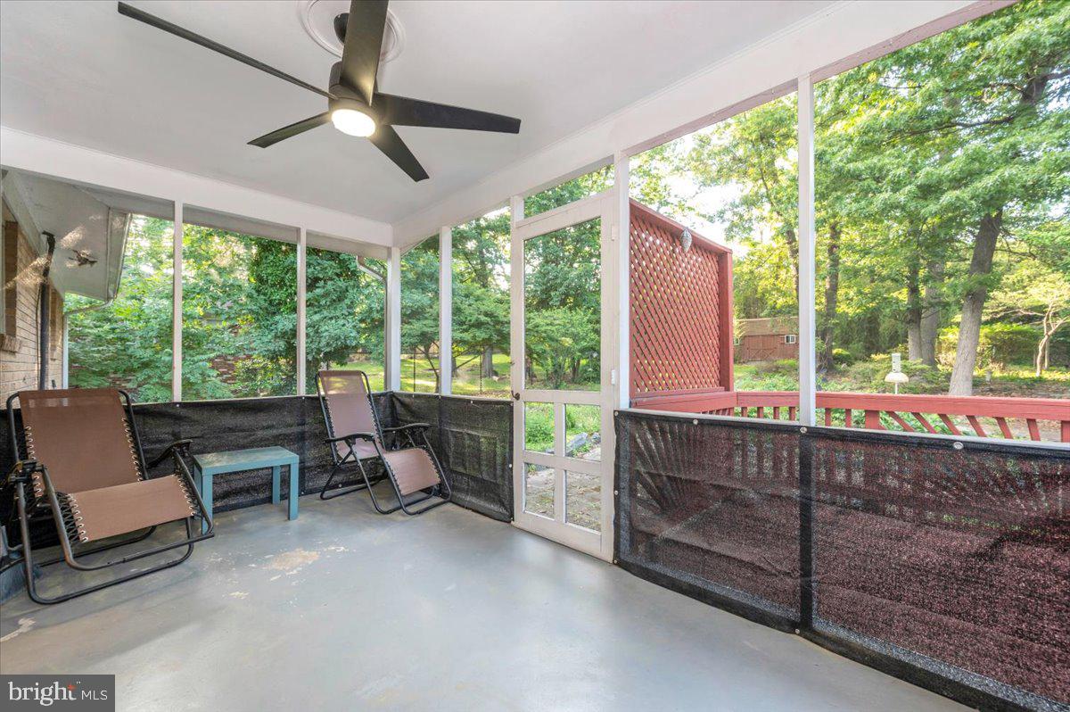 2208 Muskogee Street Adelphi, MD 20783 - Photo 30 of 71 a living room with furniture and a floor to ceiling window