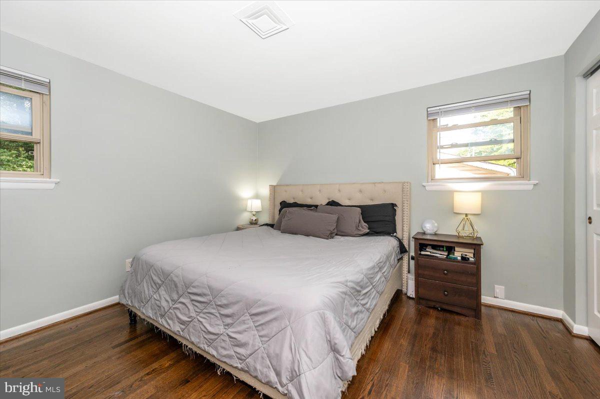 2208 Muskogee Street Adelphi, MD 20783 - Photo 33 of 71 a bedroom with a bed and wooden floor