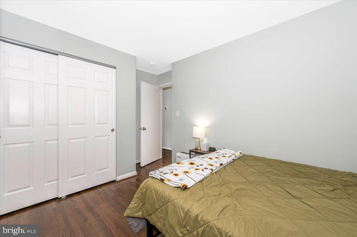2208 Muskogee Street Adelphi, MD 20783 - Photo 37 of 71 a bedroom with a bed and wooden floor