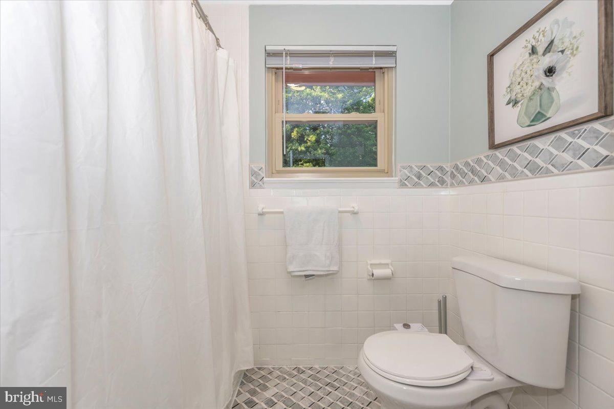 2208 Muskogee Street Adelphi, MD 20783 - Photo 41 of 71 a white toilet sitting next to a window
