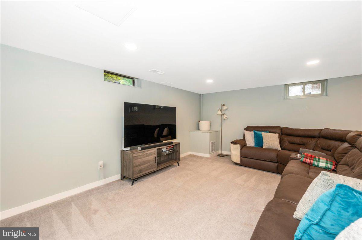 2208 Muskogee Street Adelphi, MD 20783 - Photo 53 of 71 a living room with furniture and a flat screen tv