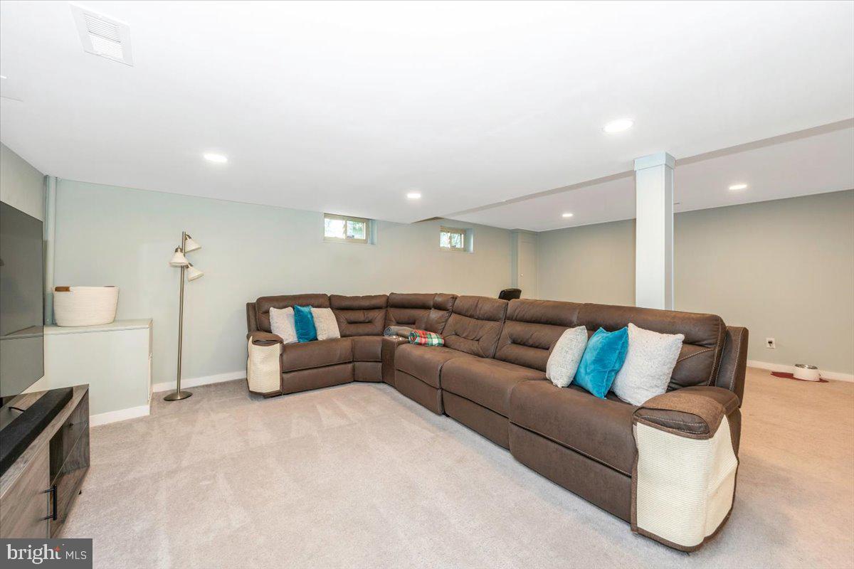 2208 Muskogee Street Adelphi, MD 20783 - Photo 54 of 71 a living room with furniture and a couch