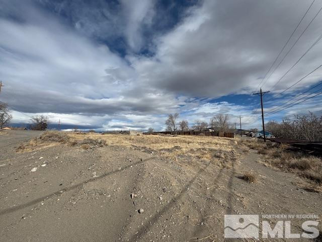 0 Main Street Wadsworth, NV 89442 - Photo 2 of 5 a view of a dry yard with wooden fence