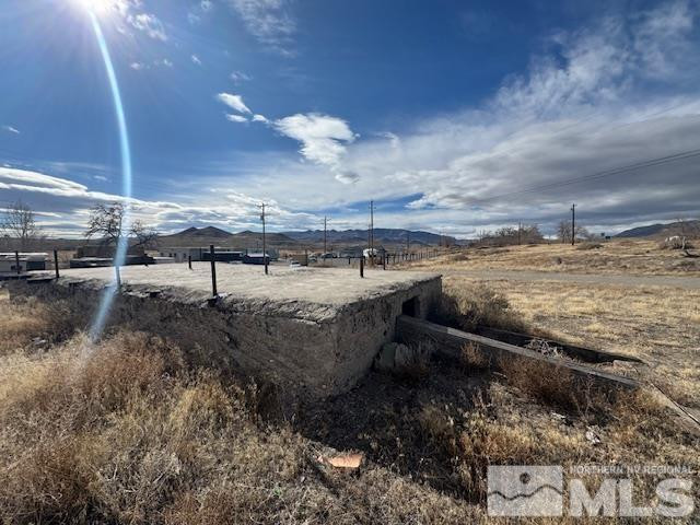 0 Main Street Wadsworth, NV 89442 - Photo 5 of 5 a view of a dry yard with wooden fence
