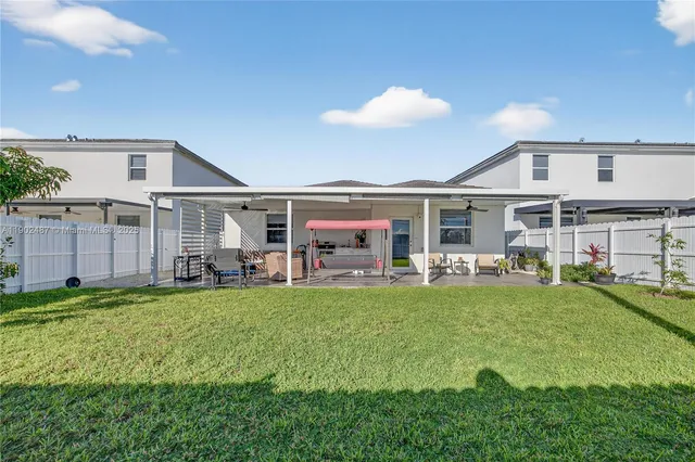 a view of a house with swimming pool and porch