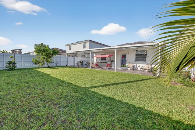 a view of a house with a big yard
