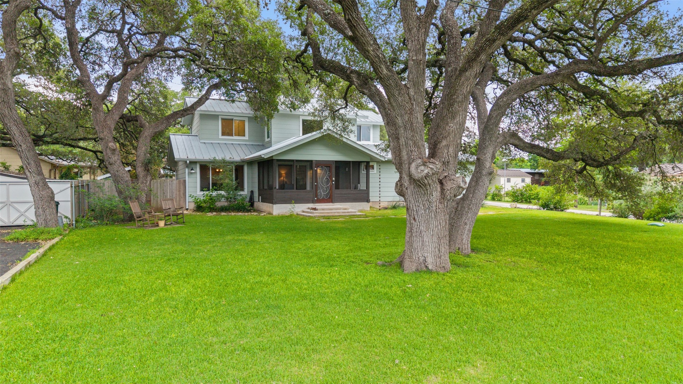 701 River Road Blanco, TX 78606 - Photo 4 of 38 a front view of a house with a yard