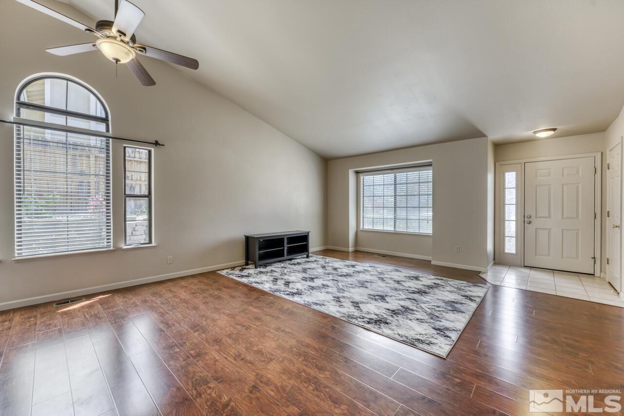 5325 Mountcrest Lane Reno, NV 89523 - Photo 3 of 17 a view of an empty room with window and wooden floor