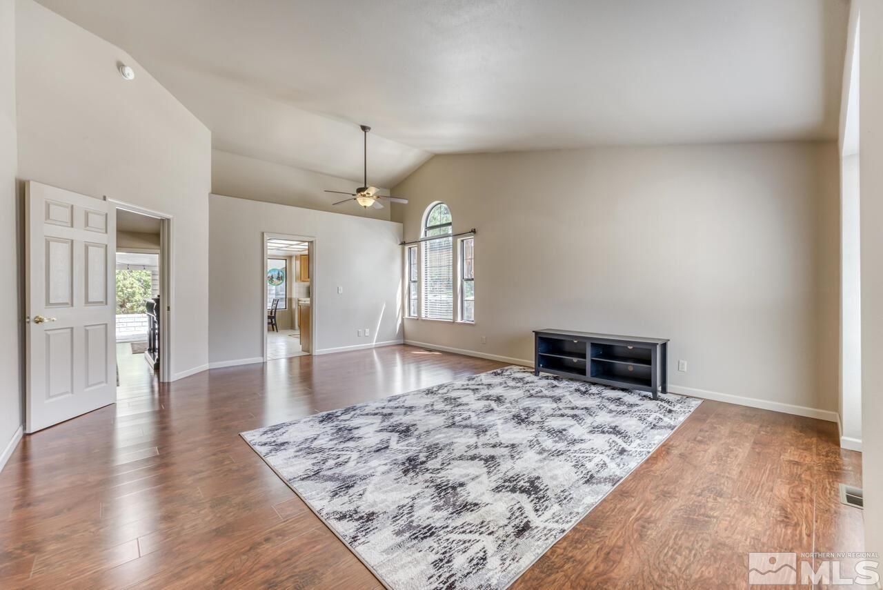 5325 Mountcrest Lane Reno, NV 89523 - Photo 4 of 17 an empty room with wooden floor and large window