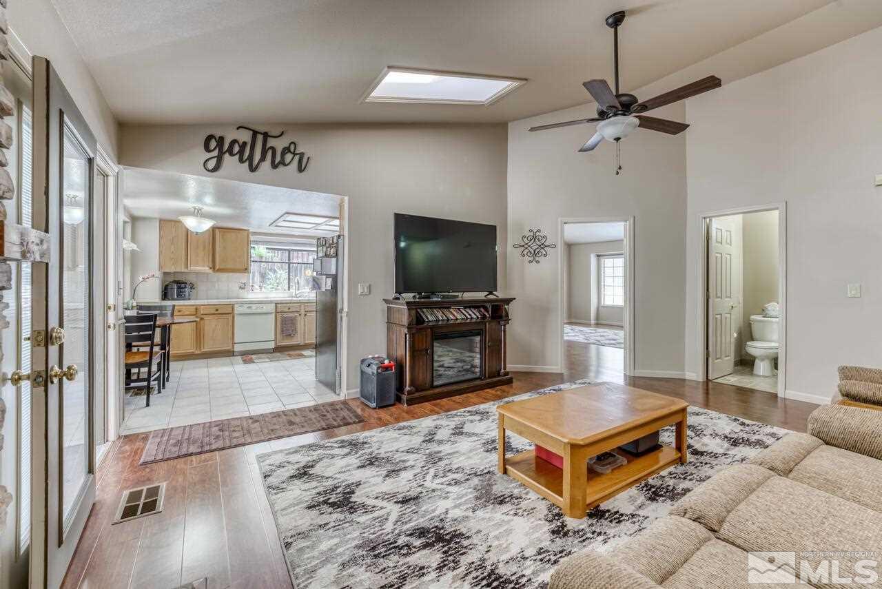 5325 Mountcrest Lane Reno, NV 89523 - Photo 7 of 17 a living room with fireplace furniture and a flat screen tv