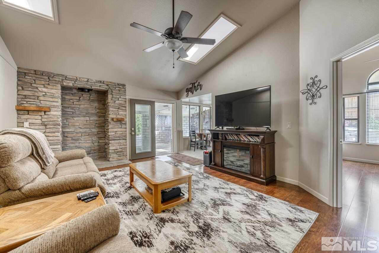 5325 Mountcrest Lane Reno, NV 89523 - Photo 8 of 17 a living room with furniture and a flat screen tv