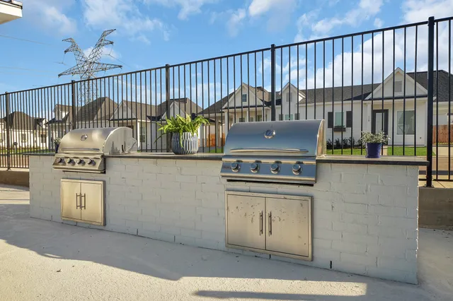 a front view of a house with swimming pool having outdoor seating
