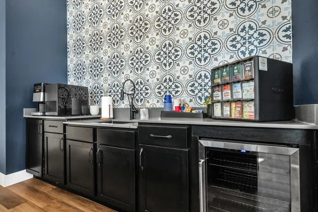a kitchen with stainless steel appliances granite countertop wooden cabinets and sink