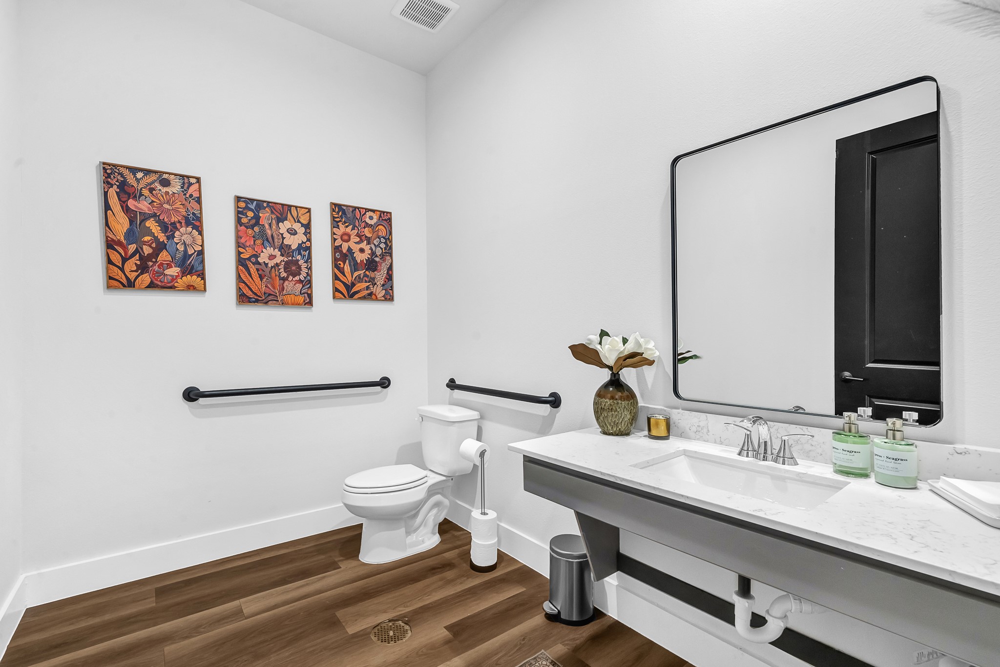 38634 Spur 149 Road, Unit 4A Magnolia, TX 77354 - Photo 45 of 50 a bathroom with a sink a toilet and mirror