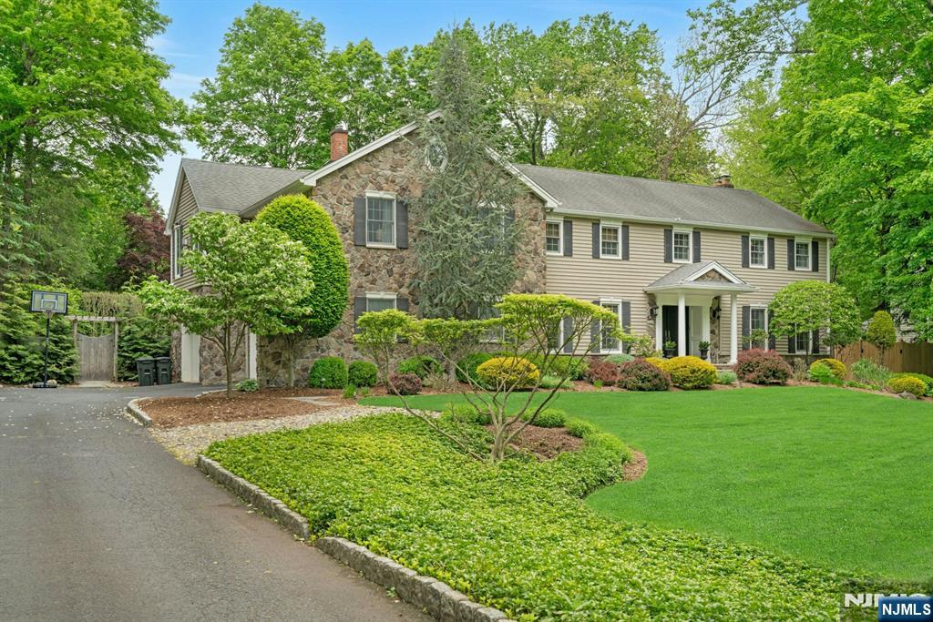 48 Hopper Farm Road Upper Saddle River, NJ 07458 - Photo 1 of 43 a front view of a house with a yard and porch