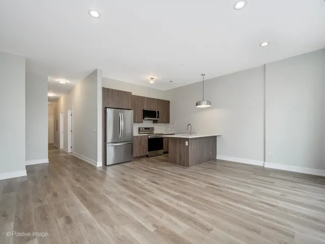 a view of kitchen with wooden floor