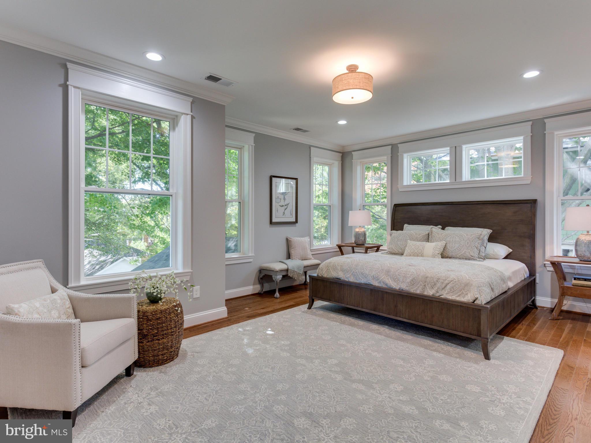 3722 Chesapeake Street Northwest Washington, DC 20016 - Photo 12 of 30 a spacious bedroom with a bed and glass window