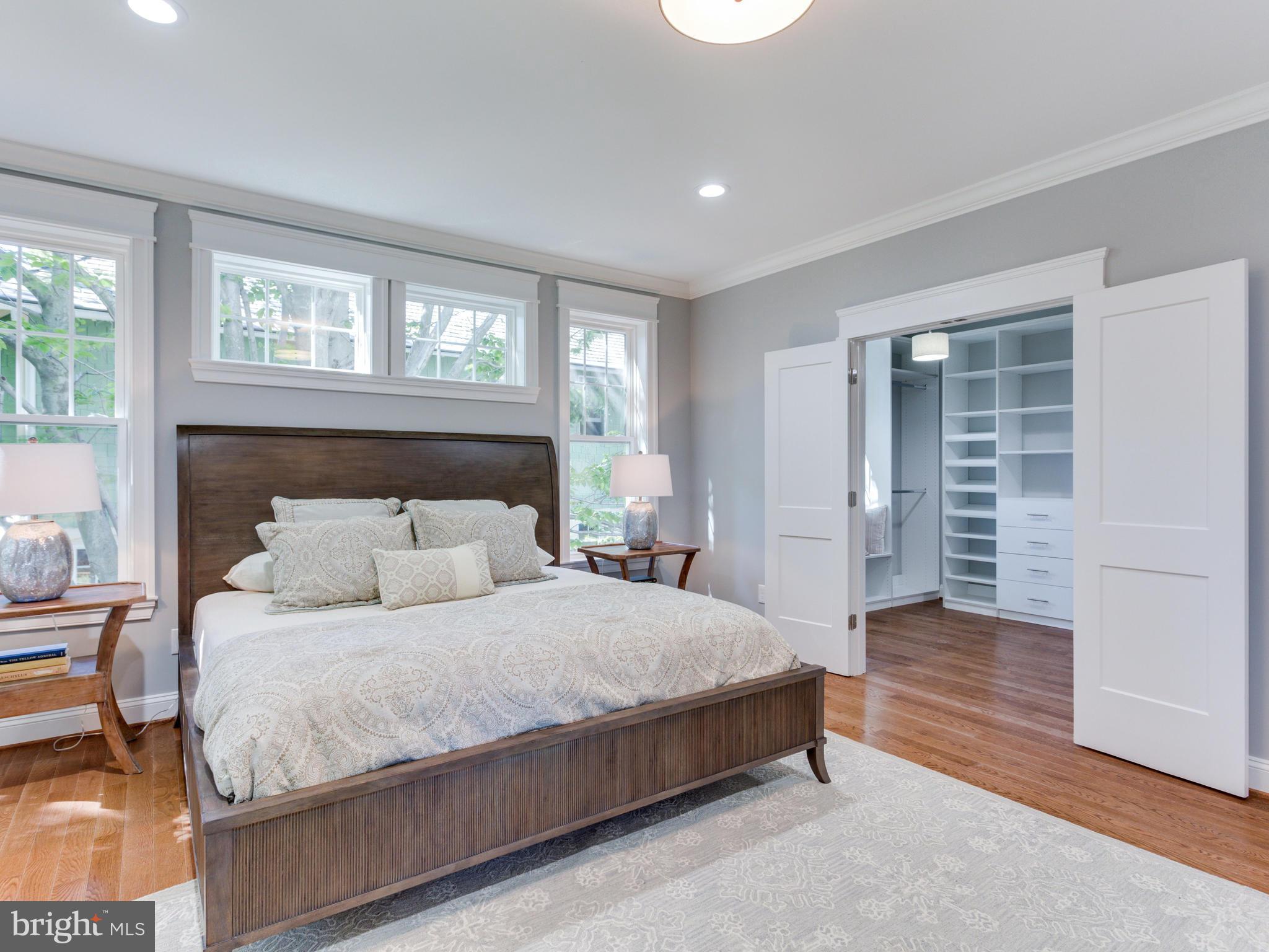 3722 Chesapeake Street Northwest Washington, DC 20016 - Photo 13 of 30 a bedroom with a large bed and a window