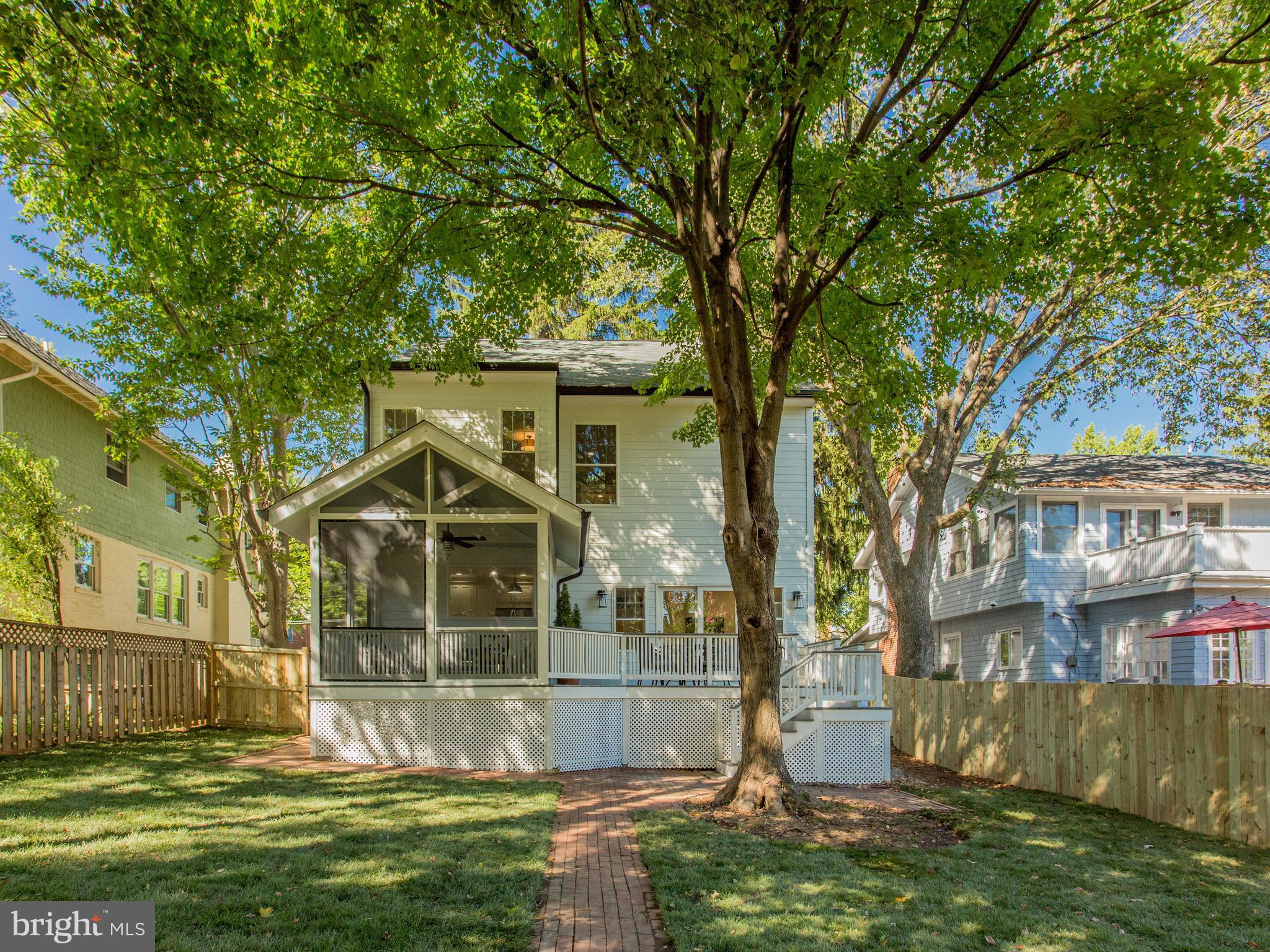 3722 Chesapeake Street Northwest Washington, DC 20016 - Photo 28 of 30 a front view of a house with a garden