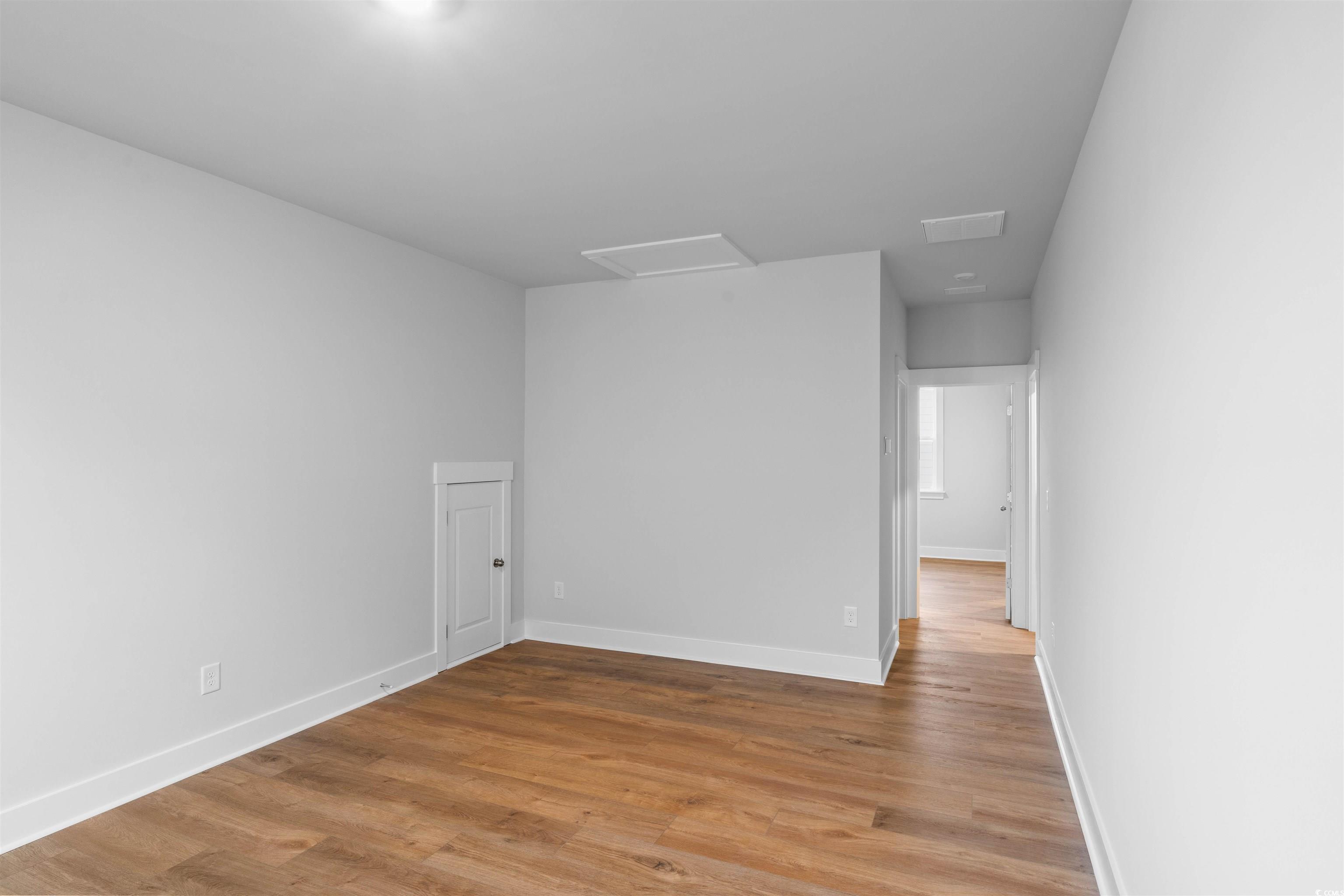 224 Atlantic Breeze Street Myrtle Beach, SC 29572 - Photo 14 of 39 Spare room featuring attic access and light wood-type flooring