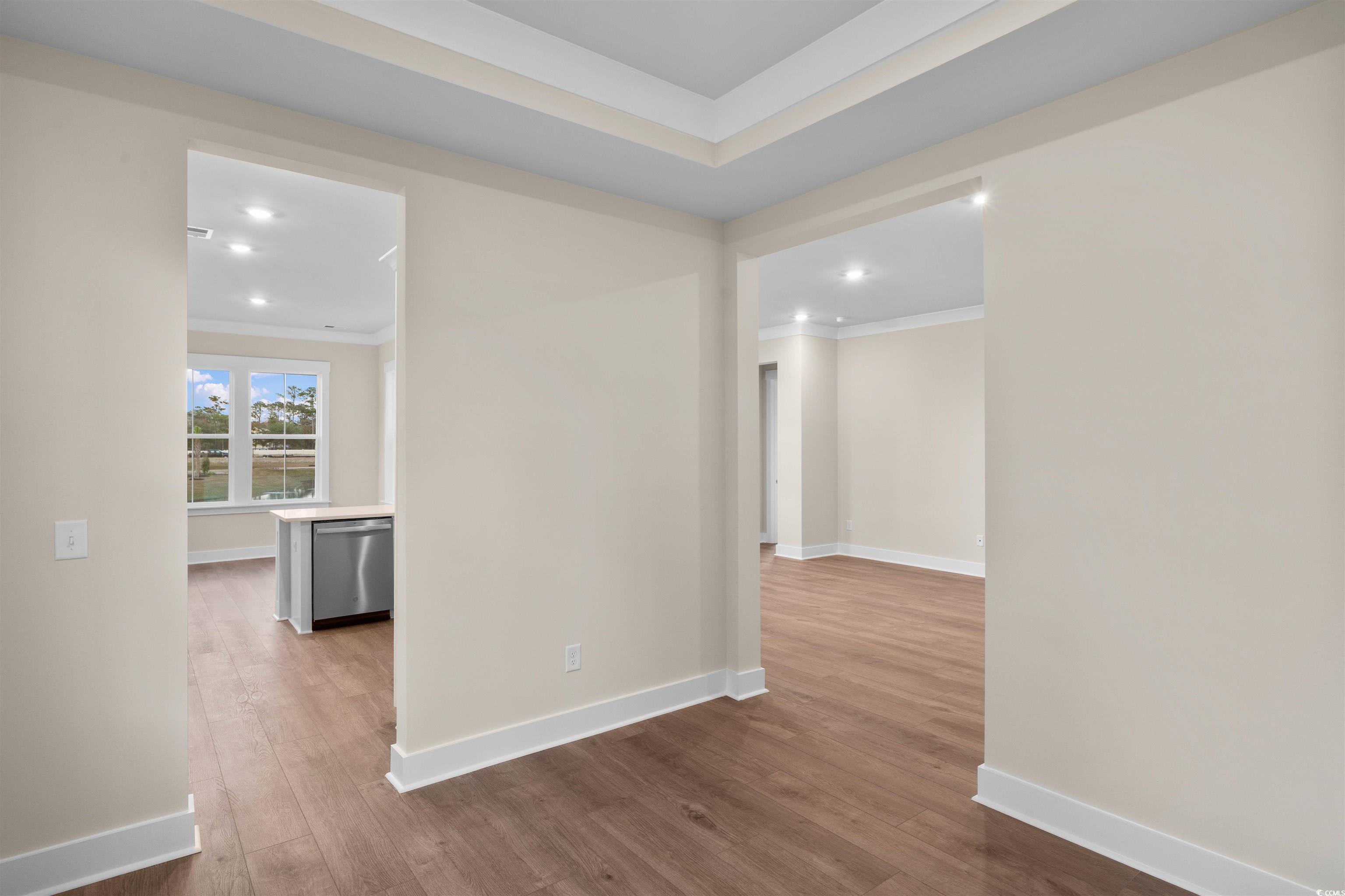 224 Atlantic Breeze Street Myrtle Beach, SC 29572 - Photo 17 of 39 Unfurnished room featuring light wood-type flooring, crown molding, and recessed lighting