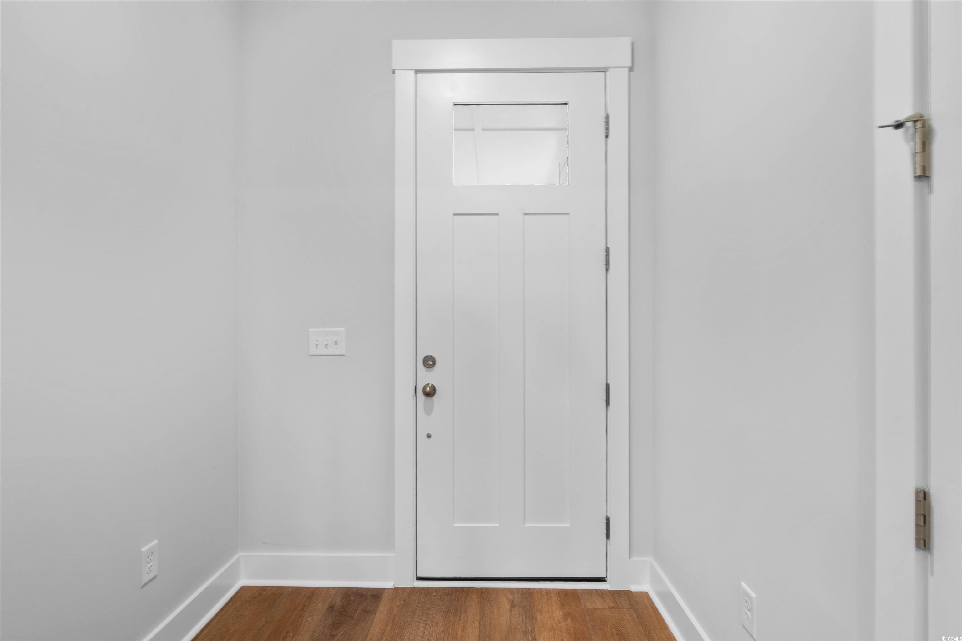 224 Atlantic Breeze Street Myrtle Beach, SC 29572 - Photo 19 of 39 Doorway with baseboards and wood finished floors
