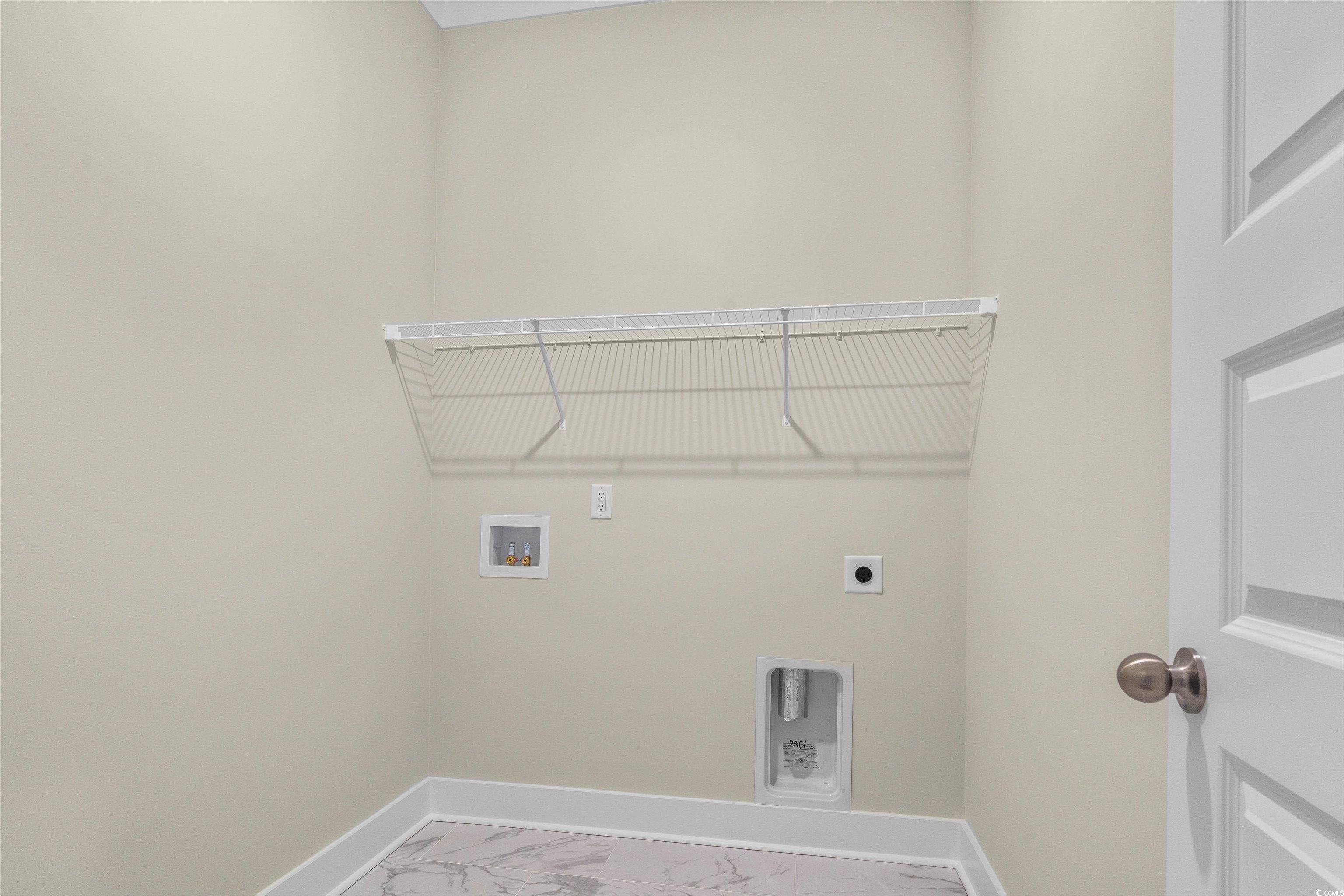 224 Atlantic Breeze Street Myrtle Beach, SC 29572 - Photo 23 of 39 Washroom featuring marble look tiles, washer hookup, and hookup for an electric dryer