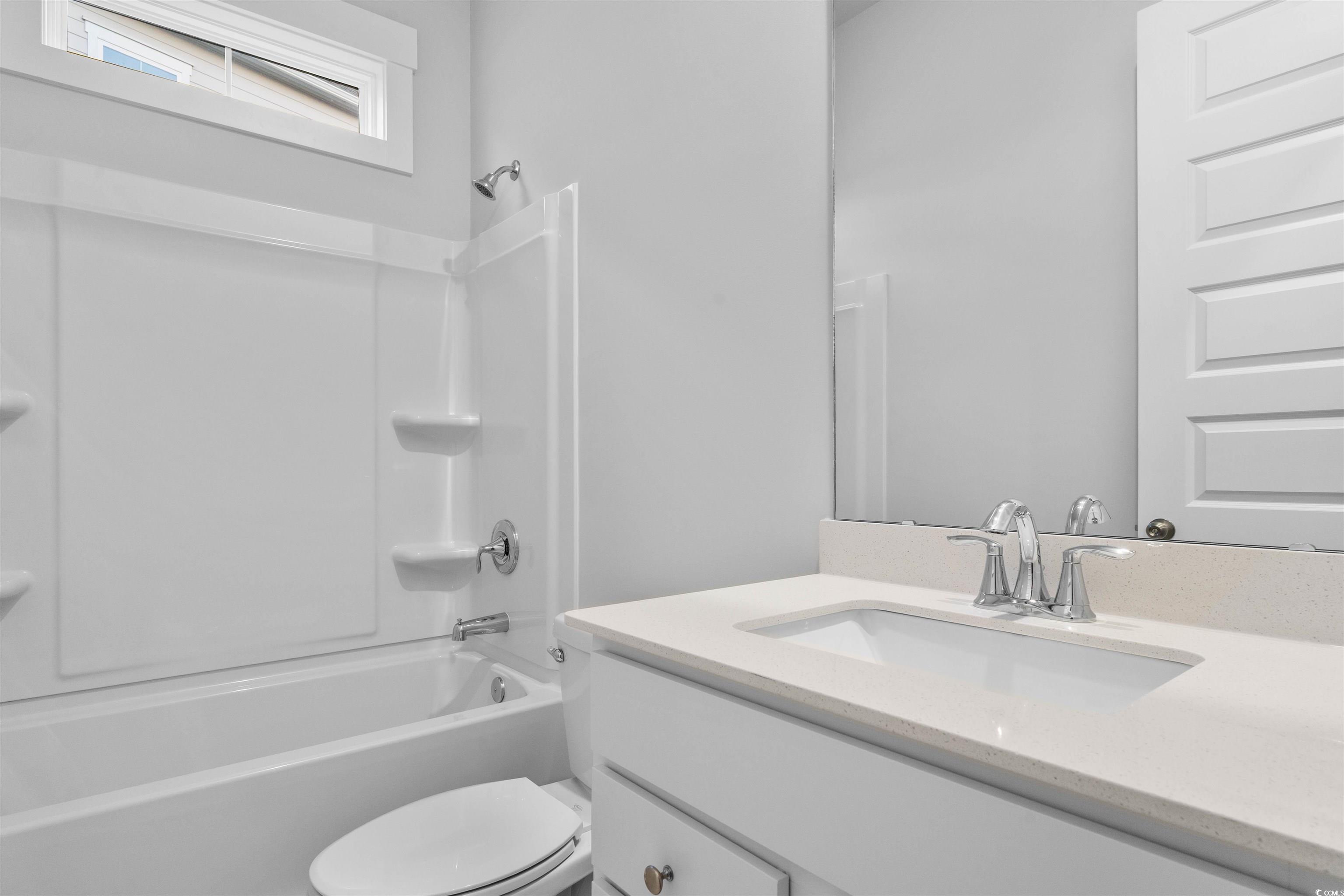 224 Atlantic Breeze Street Myrtle Beach, SC 29572 - Photo 5 of 39 Bathroom featuring tub / shower combination and vanity