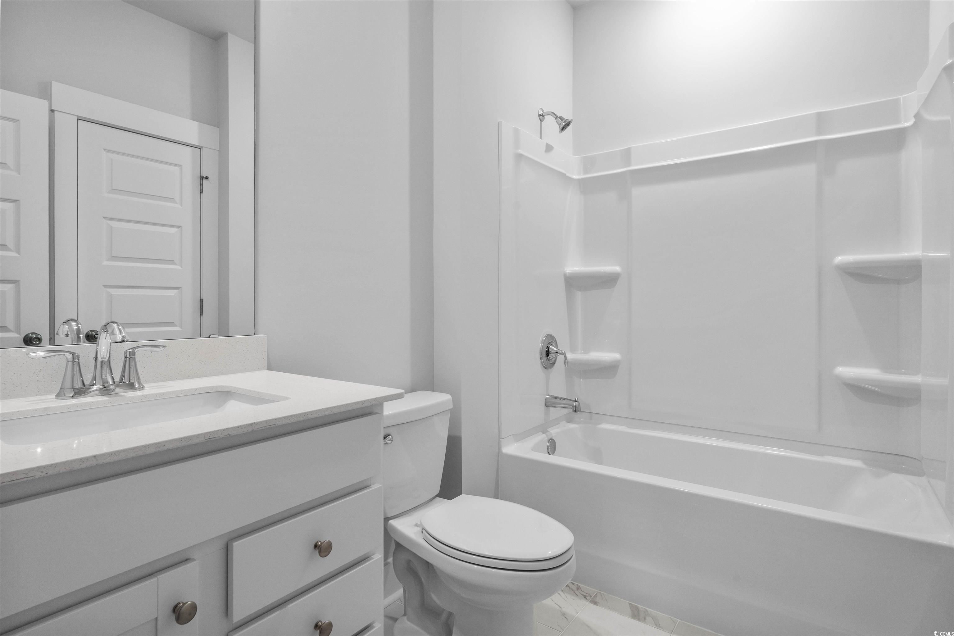 224 Atlantic Breeze Street Myrtle Beach, SC 29572 - Photo 6 of 39 Full bath featuring vanity and bathing tub / shower combination