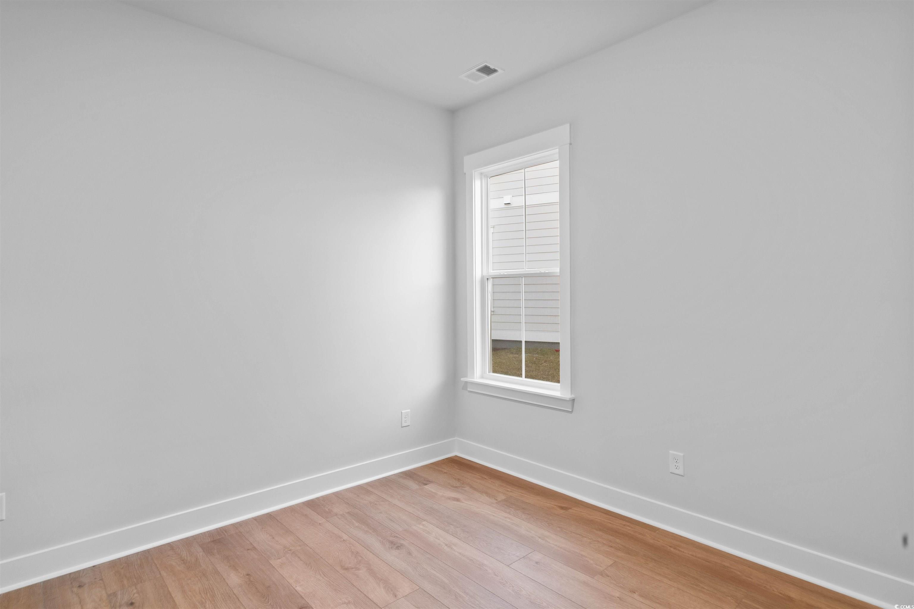224 Atlantic Breeze Street Myrtle Beach, SC 29572 - Photo 10 of 39 Spare room featuring baseboards and light wood-style floors