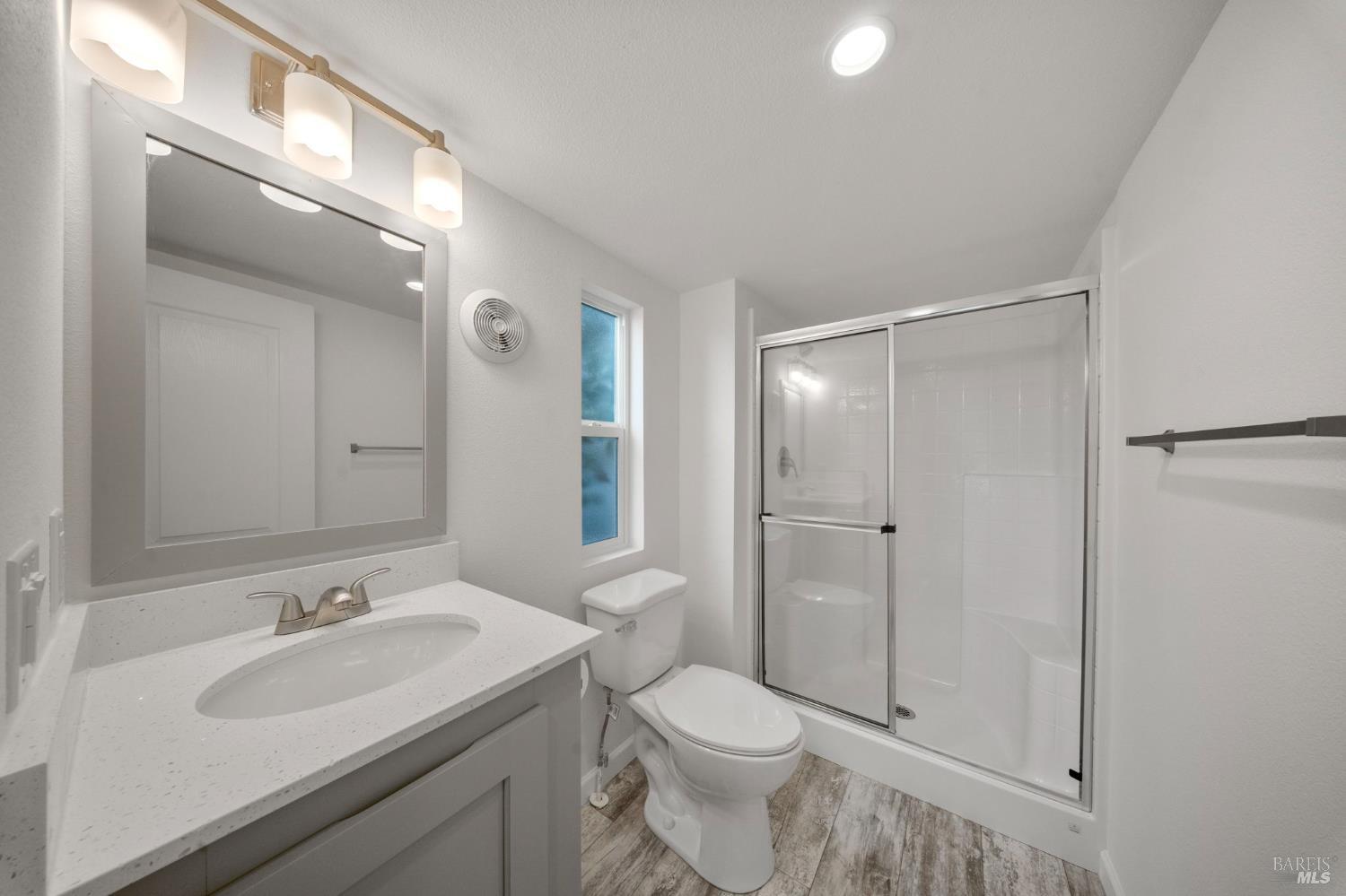 742 Francisco Boulevard West, Unit B12 San Rafael, CA 94901 - Photo 12 of 16 a bathroom with a sink toilet and shower