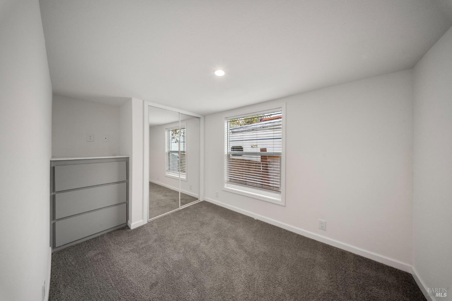 742 Francisco Boulevard West, Unit B12 San Rafael, CA 94901 - Photo 13 of 16 a view of an empty room with a closet