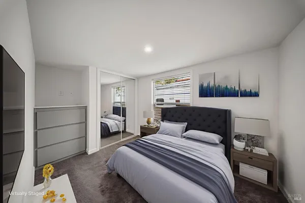 an empty room with windows and closet