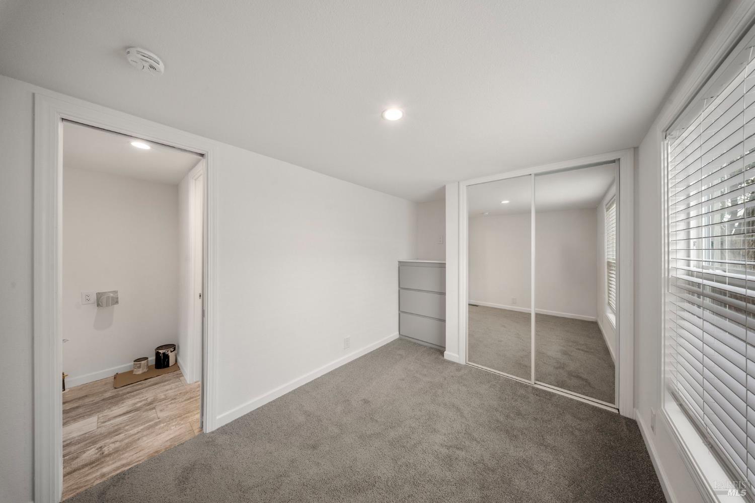 742 Francisco Boulevard West, Unit B12 San Rafael, CA 94901 - Photo 15 of 16 an empty room with windows and closet